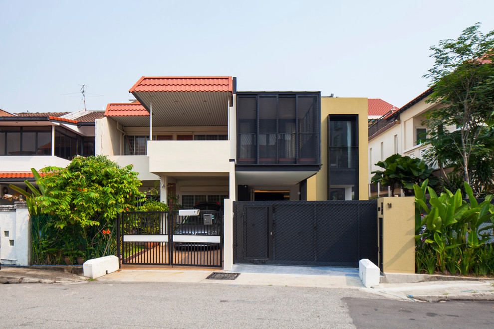 This is an example of a small contemporary two floor house exterior in Singapore.