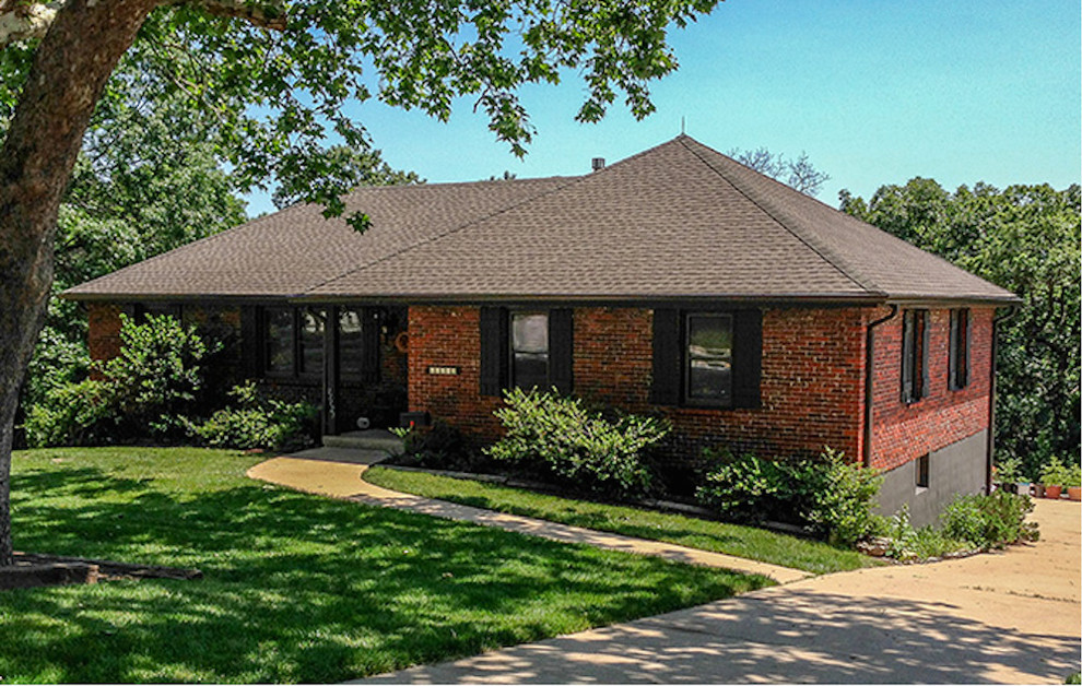 Design ideas for a small and red classic bungalow brick house exterior in Denver.