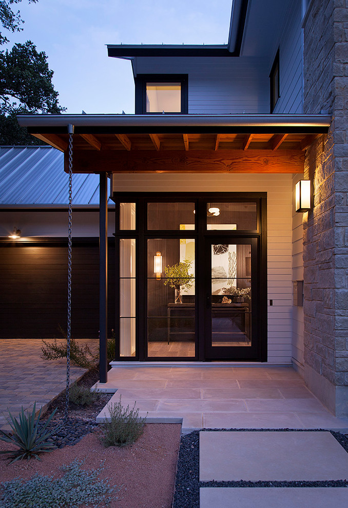 Modern white two-story mixed siding exterior home idea in Austin with a hip roof