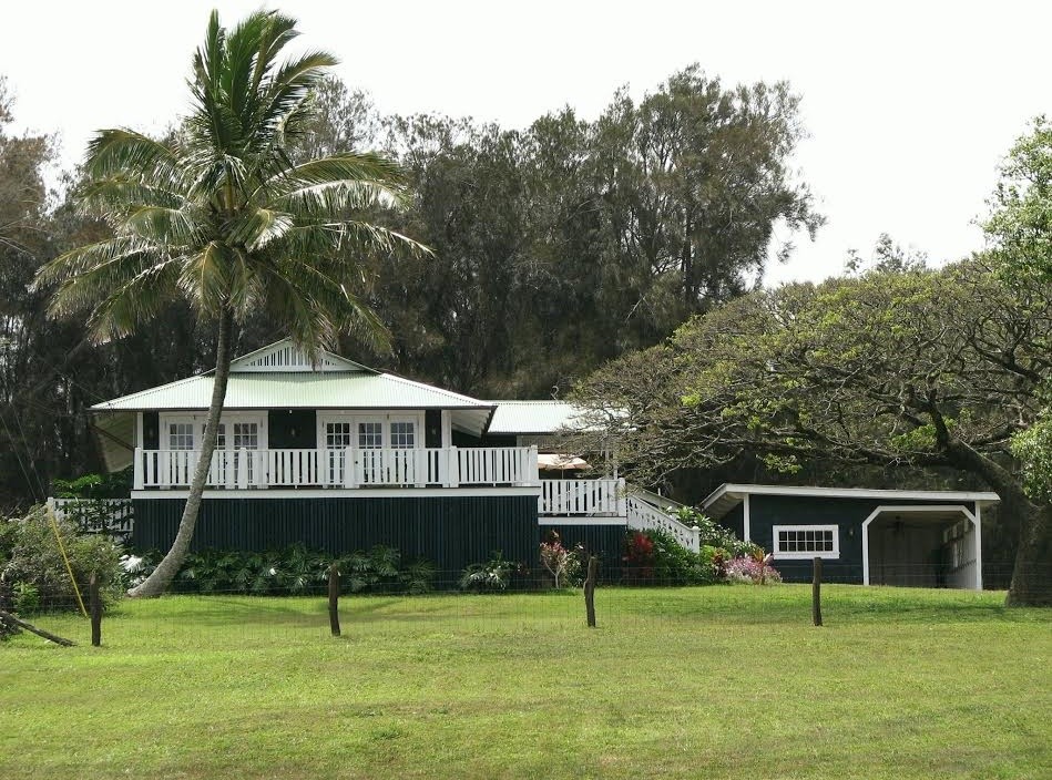 Inspiration for a medium sized and blue world-inspired two floor detached house in Hawaii with wood cladding, a hip roof and a metal roof.