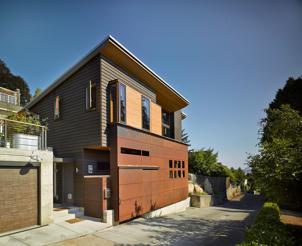 Mid-sized modern gray two-story metal exterior home idea in Seattle