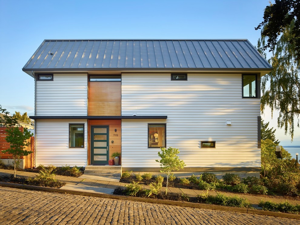 Mid-sized transitional white two-story mixed siding exterior home photo in Seattle