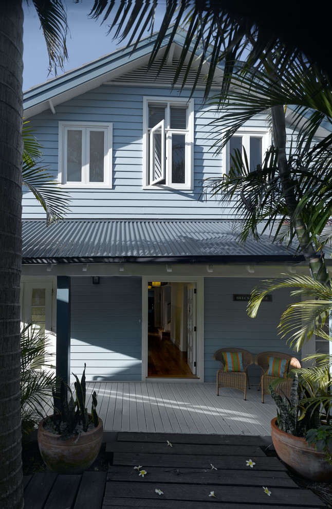 Inspiration for a medium sized and blue coastal two floor house exterior in Sydney with wood cladding.