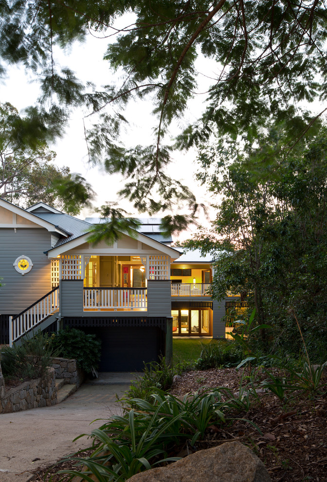 Example of a mid-sized classic gray two-story mixed siding exterior home design in Brisbane with a metal roof