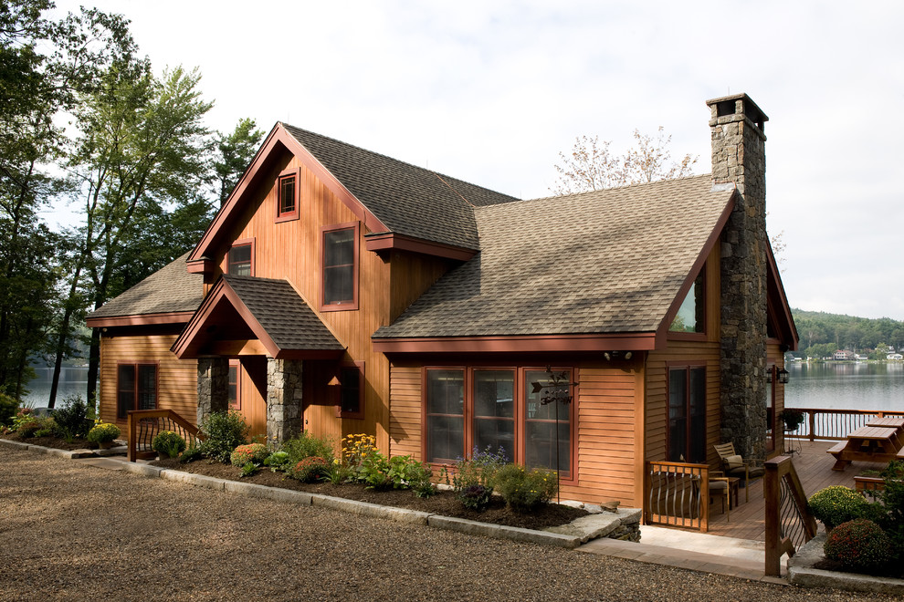 Rustic house exterior in Boston with wood cladding.