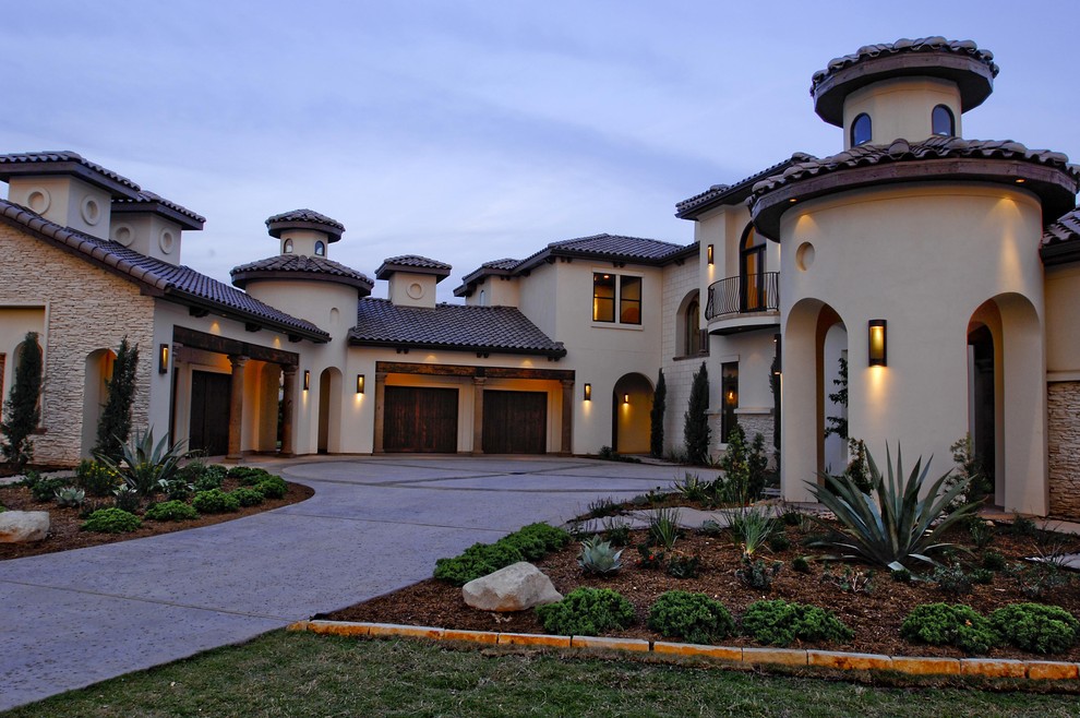 Example of a tuscan exterior home design in Austin with a tile roof