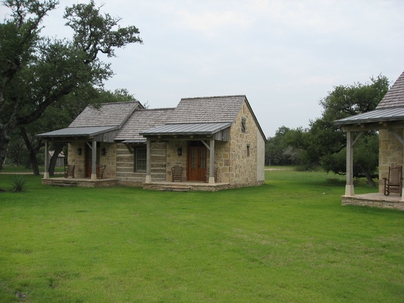 Design ideas for a gey rustic bungalow house exterior in Austin with a hip roof.