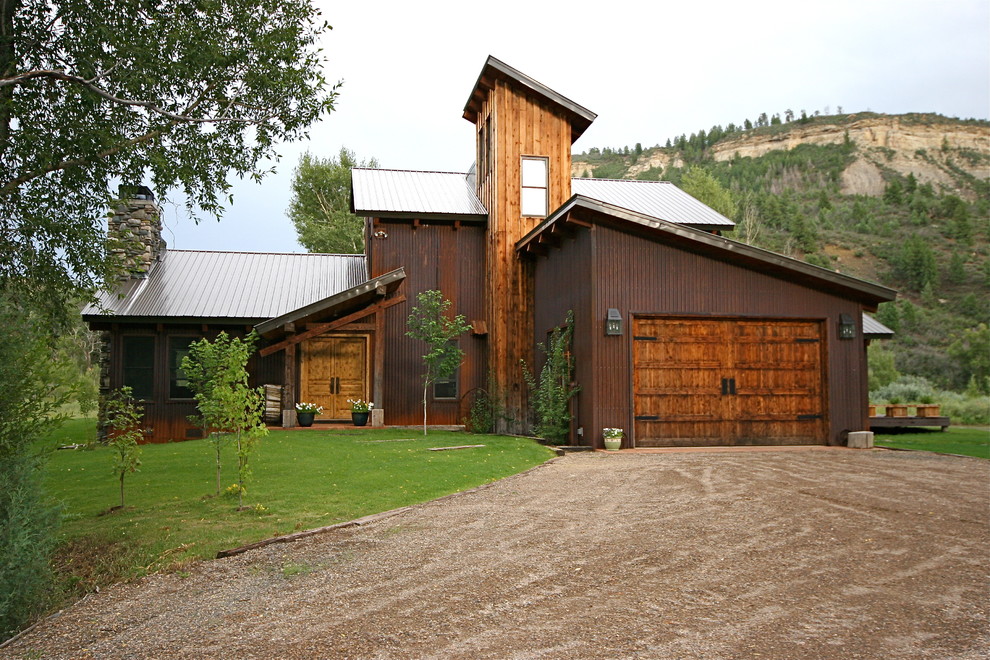 Inspiration for a brown rustic house exterior in Denver.