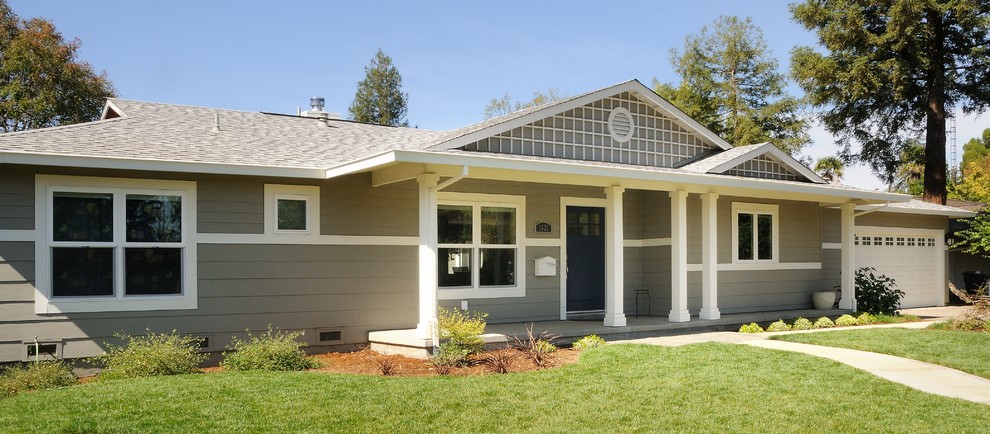 This is an example of a medium sized and gey traditional bungalow house exterior in Sacramento with concrete fibreboard cladding.