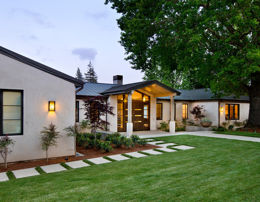 Inspiration for a medium sized and beige traditional bungalow render house exterior in San Francisco.