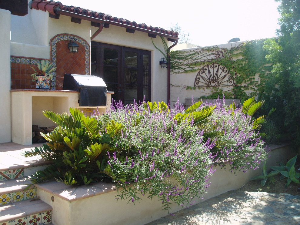 Inspiration for a mediterranean white stucco house exterior remodel in San Diego with a shingle roof
