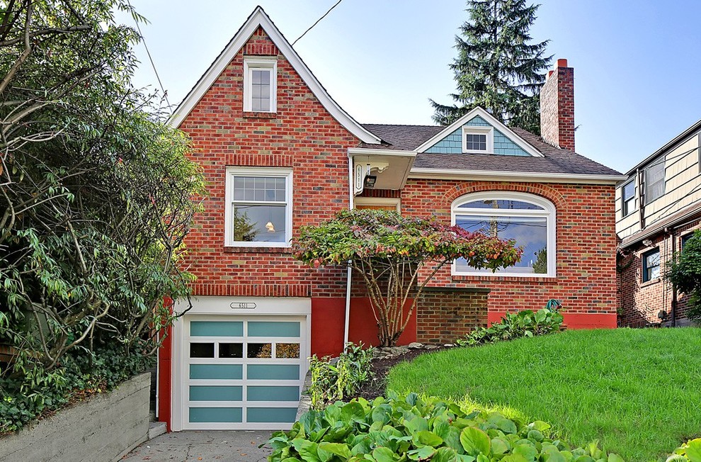 Example of a classic brick exterior home design in Seattle
