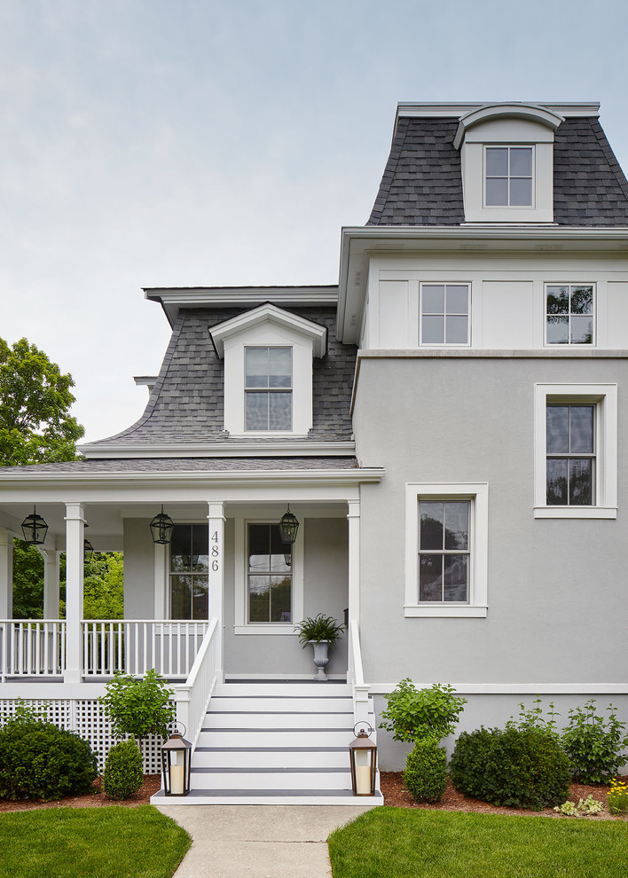 Inspiration for a large victorian gray three-story stucco house exterior remodel in Chicago with a hip roof and a shingle roof