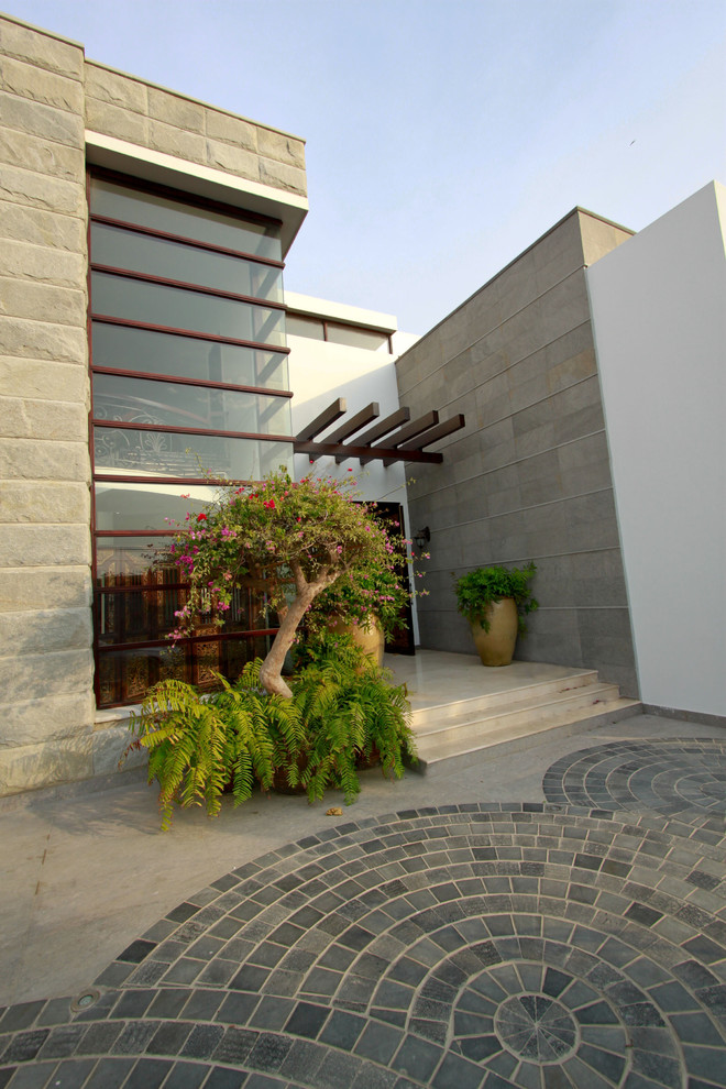 Inspiration for a contemporary two floor house exterior in Other.