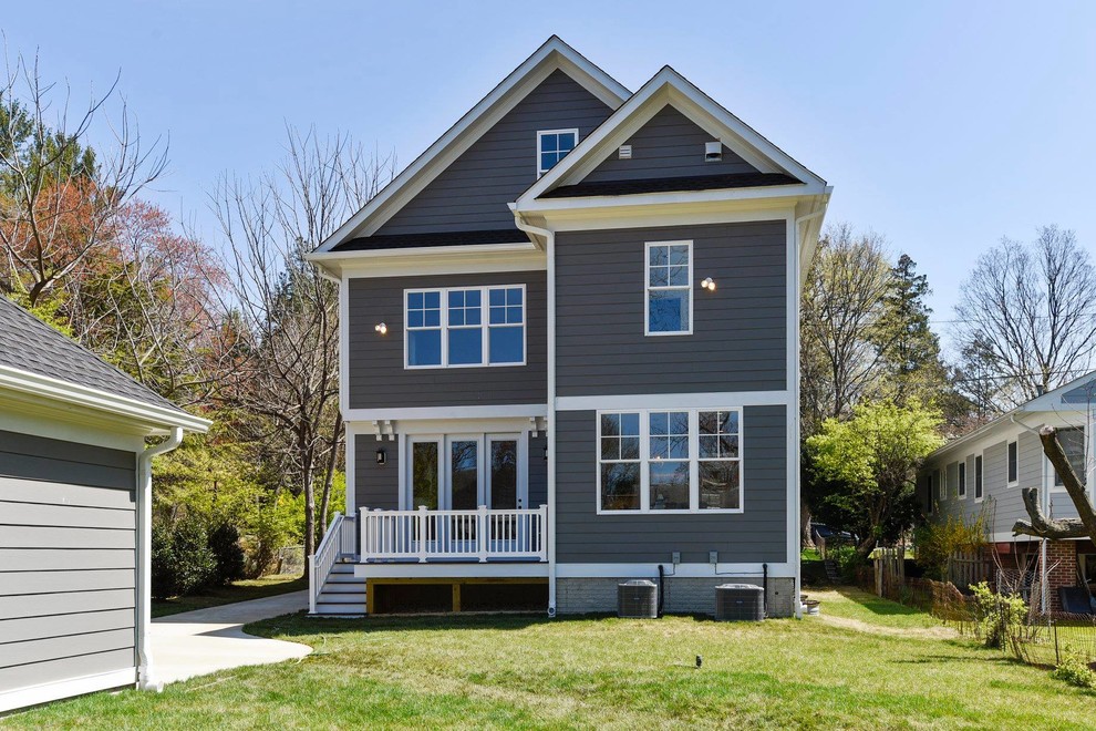 Mid-sized elegant gray three-story mixed siding house exterior photo in DC Metro with a hip roof and a shingle roof