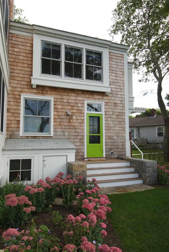 Photo of a nautical two floor house exterior in Boston with wood cladding.