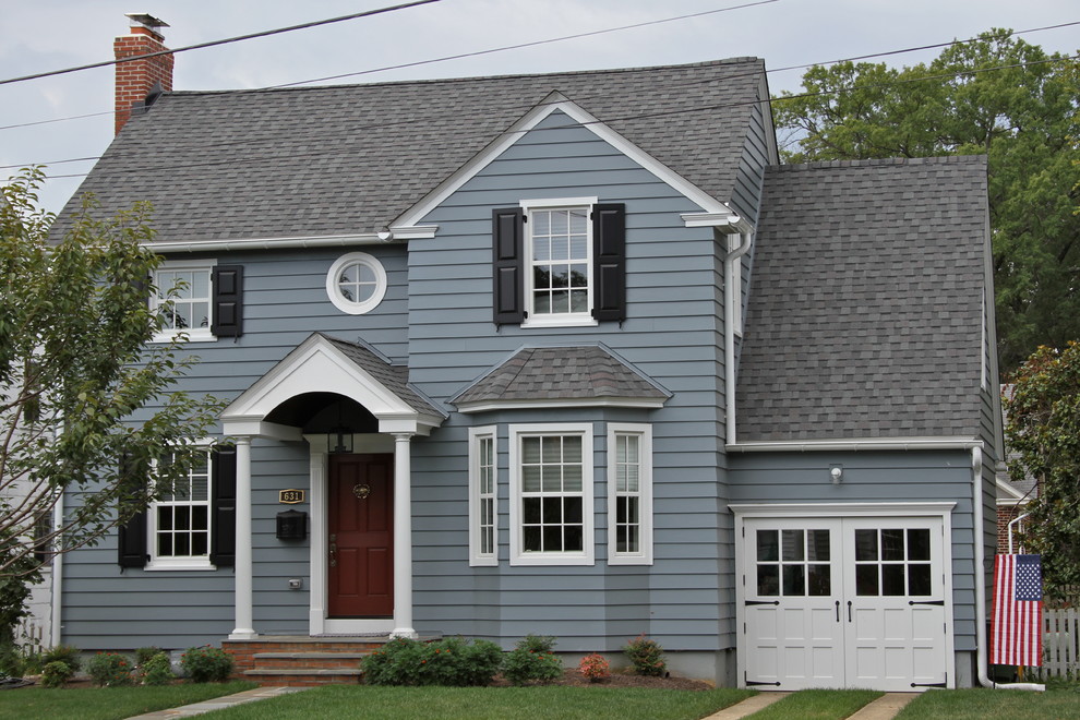 Design ideas for a medium sized and blue classic two floor detached house in Baltimore with vinyl cladding, a half-hip roof and a shingle roof.