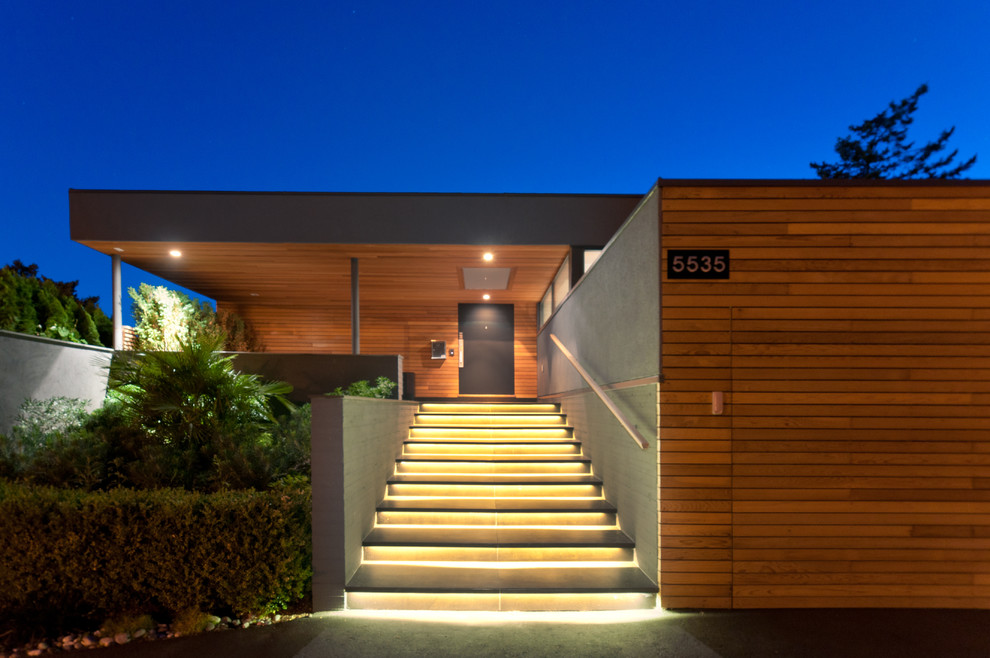 Ejemplo de fachada minimalista de una planta con escaleras