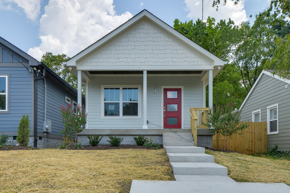 Photo of a small and gey modern bungalow house exterior in Nashville with concrete fibreboard cladding.