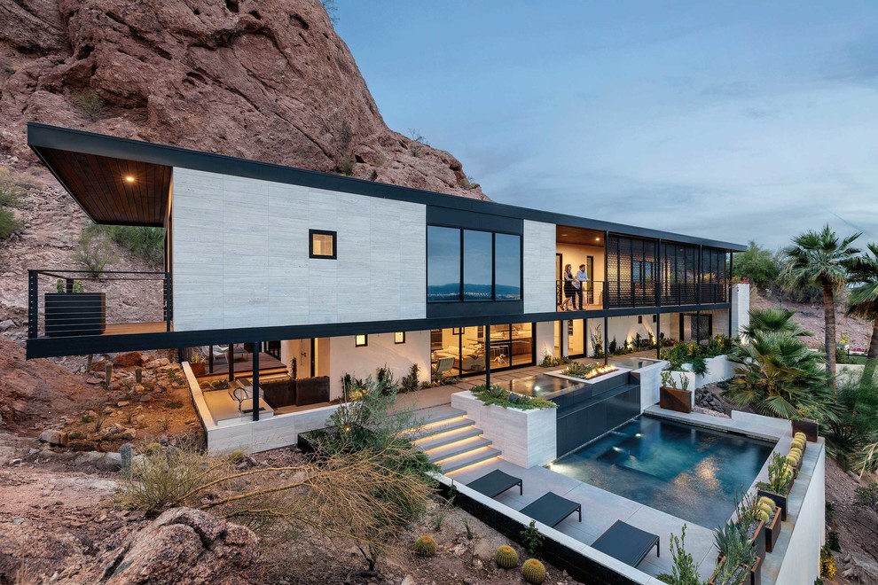 Example of a trendy gray two-story exterior home design in Phoenix