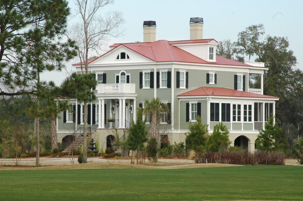 Huge coastal gray three-story exterior home idea in Philadelphia with a hip roof and a red roof