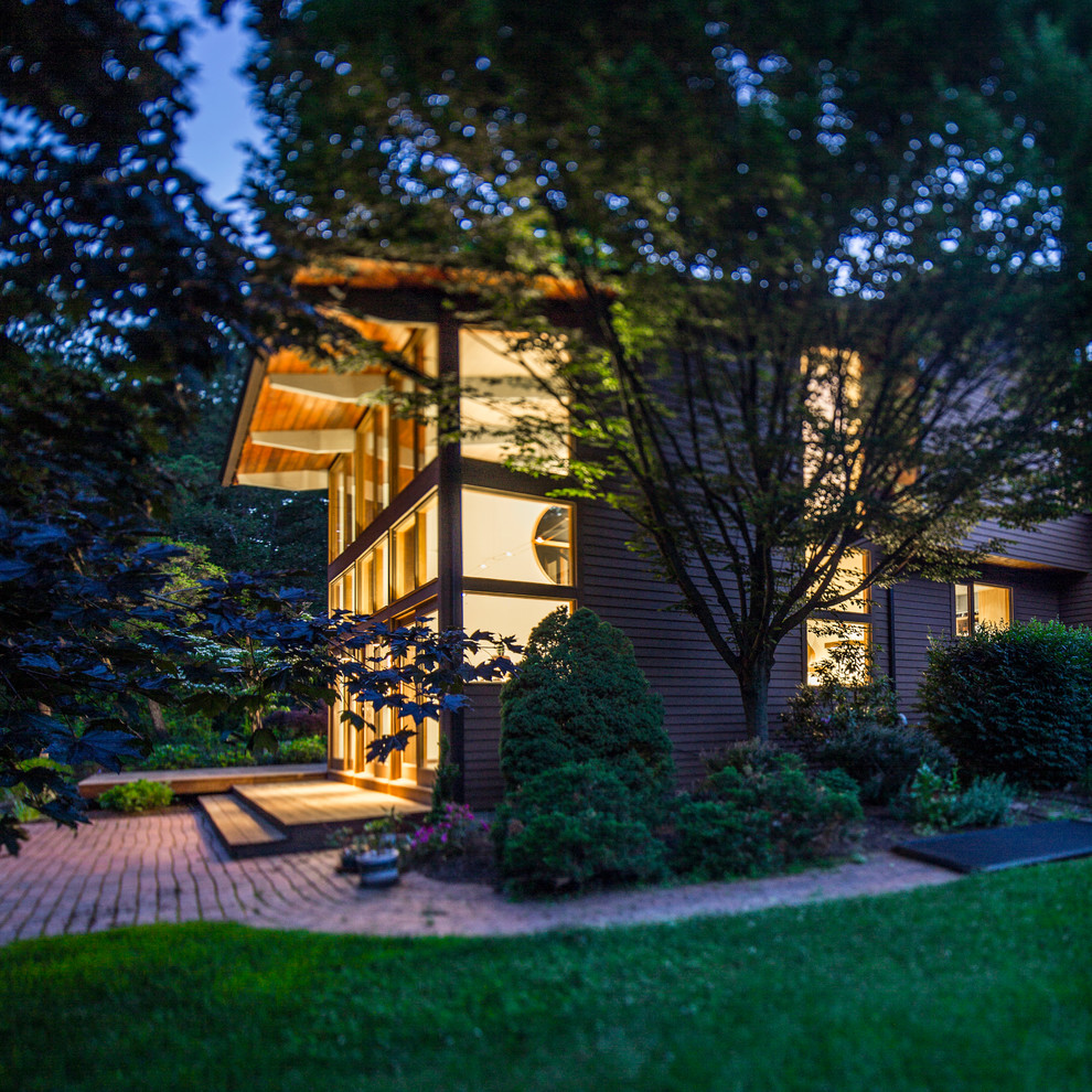 Design ideas for a large and brown contemporary two floor detached house in New York with wood cladding and a lean-to roof.