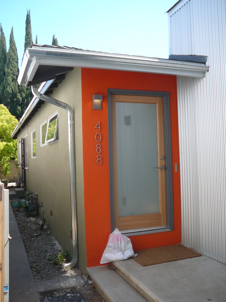 Example of a small urban gray one-story metal gable roof design in Los Angeles
