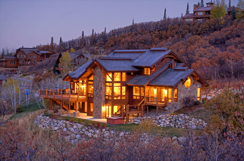 Inspiration for a large and brown rustic two floor house exterior in Denver with mixed cladding.