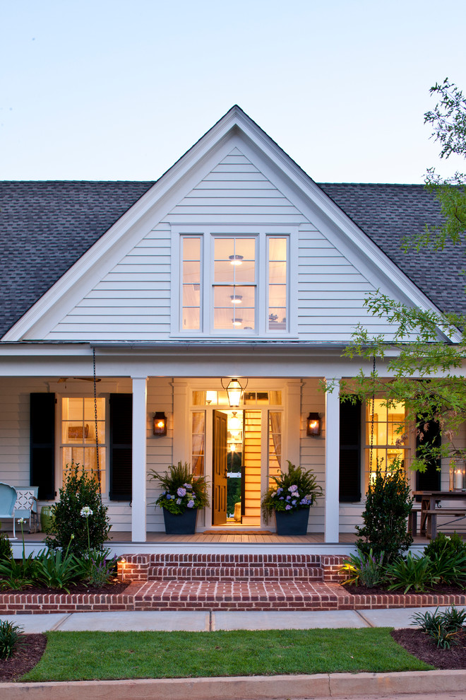 Cottage white two-story wood exterior home photo in Atlanta