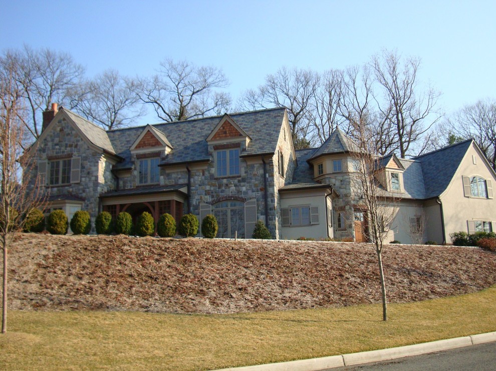 Large elegant gray two-story mixed siding house exterior photo in New York with a hip roof and a shingle roof