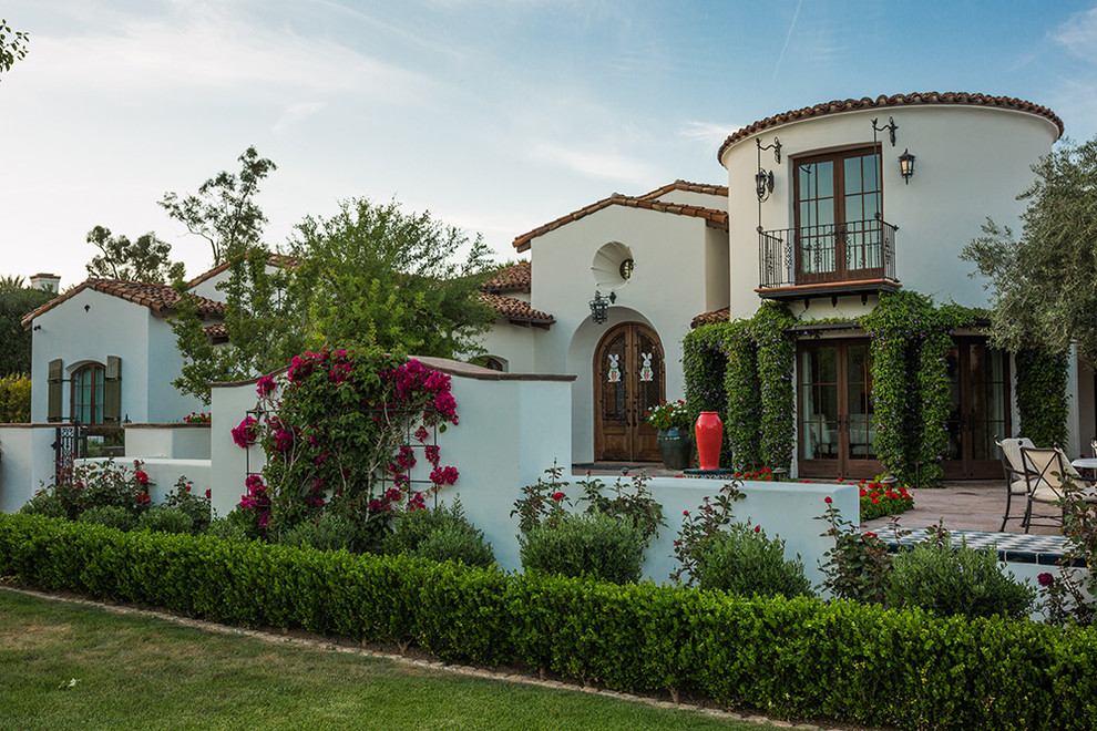 Example of a mid-sized tuscan exterior home design in Phoenix