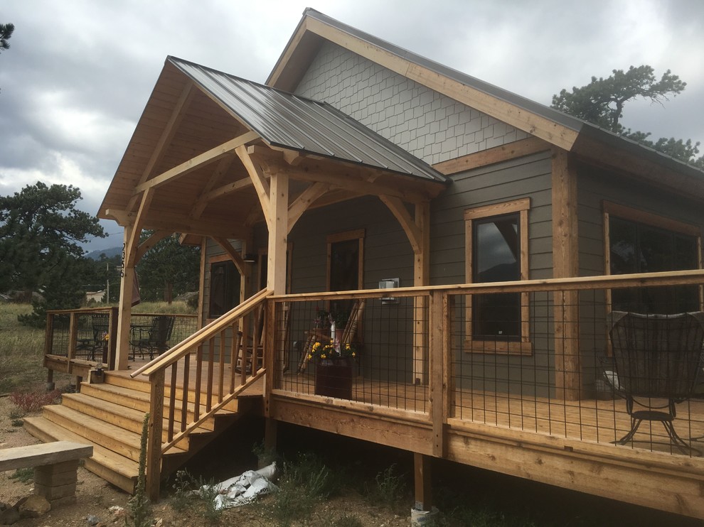 Medium sized classic house exterior in Denver with wood cladding and a pitched roof.