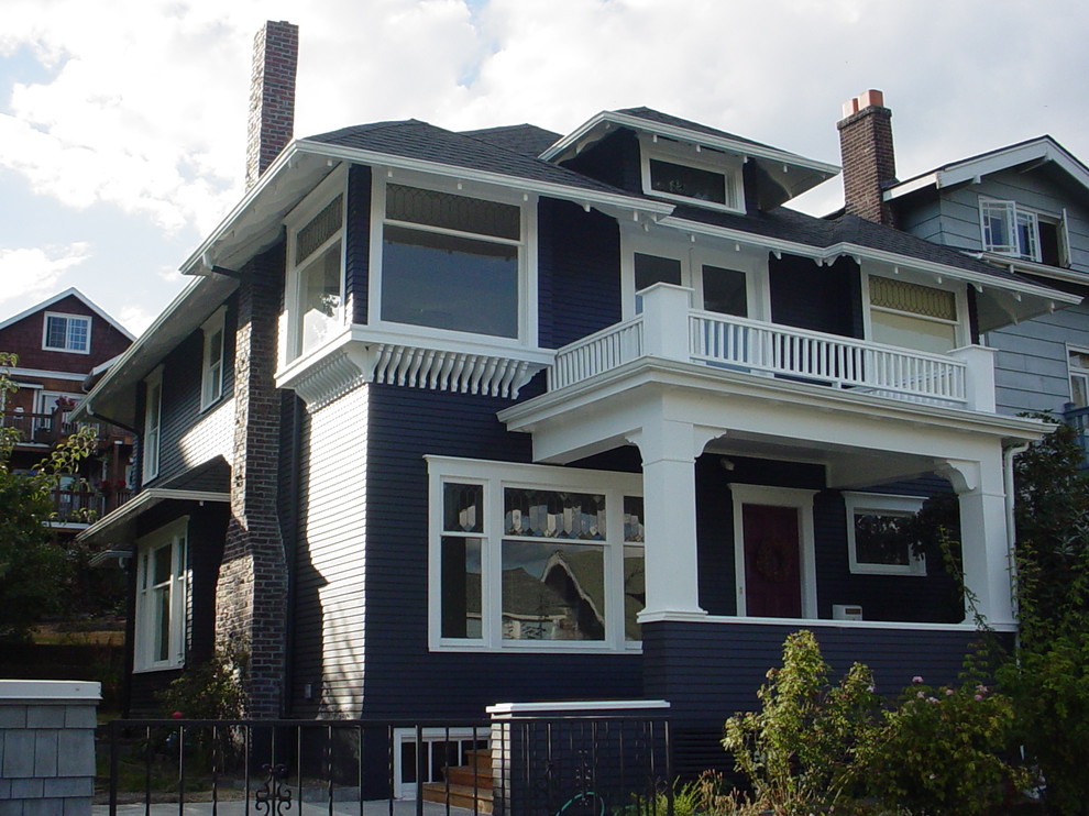 Inspiration for a medium sized and blue traditional two floor house exterior in Seattle with vinyl cladding and a hip roof.