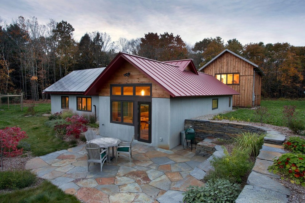 Example of a large farmhouse gray two-story mixed siding house exterior design in Boston