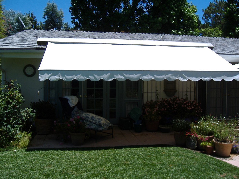 Retractable Awning over outdoor seating area Exterior Los Angeles