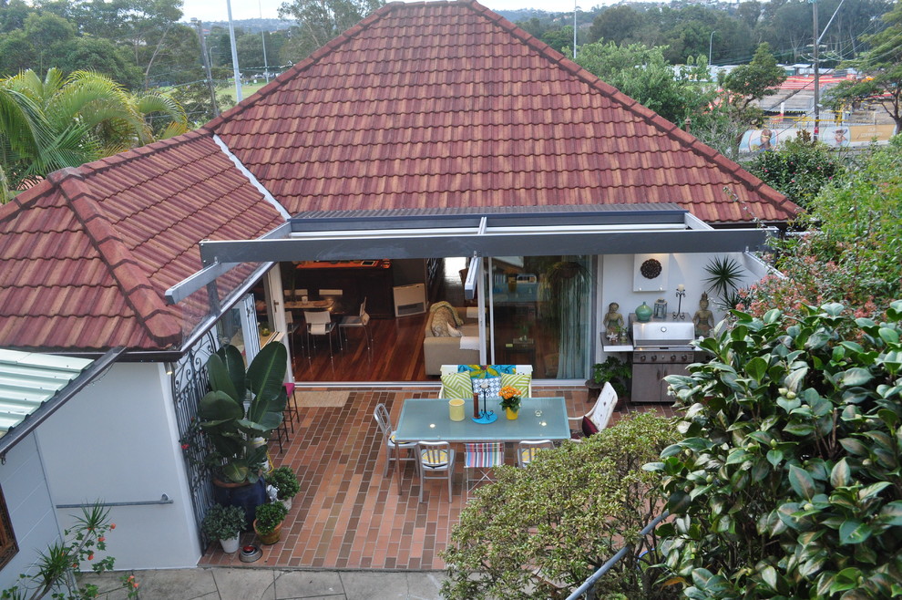 Mittelgroßes, Einstöckiges Stilmix Haus mit Backsteinfassade und brauner Fassadenfarbe in Sydney