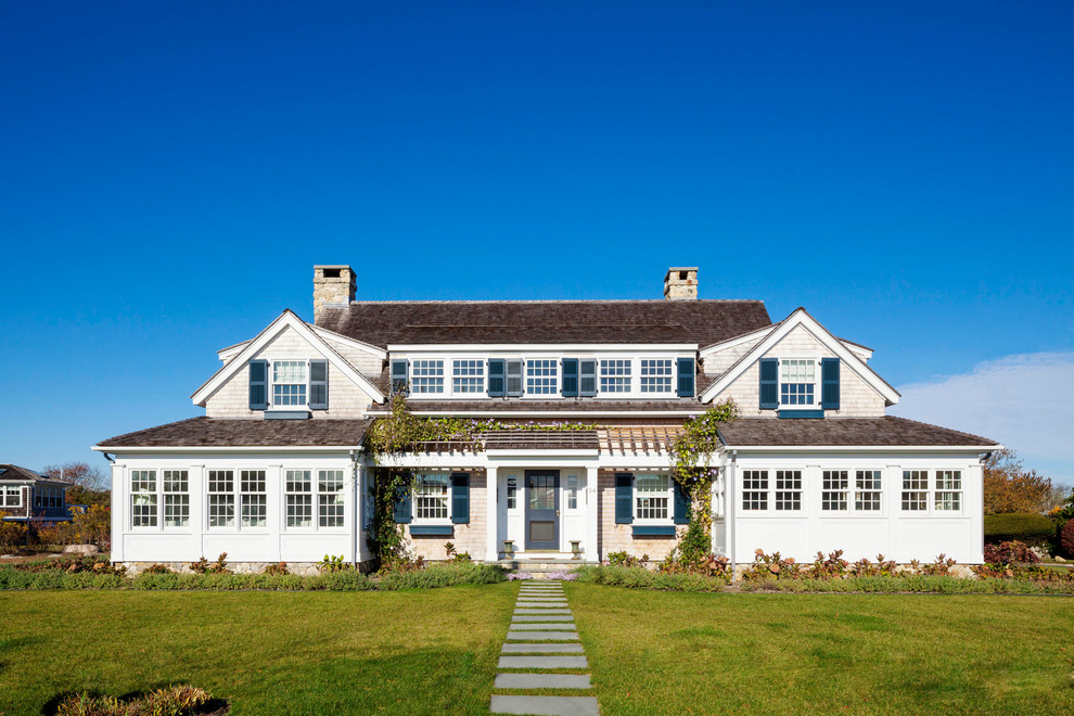 Inspiration for a large coastal two-story wood exterior home remodel in Providence