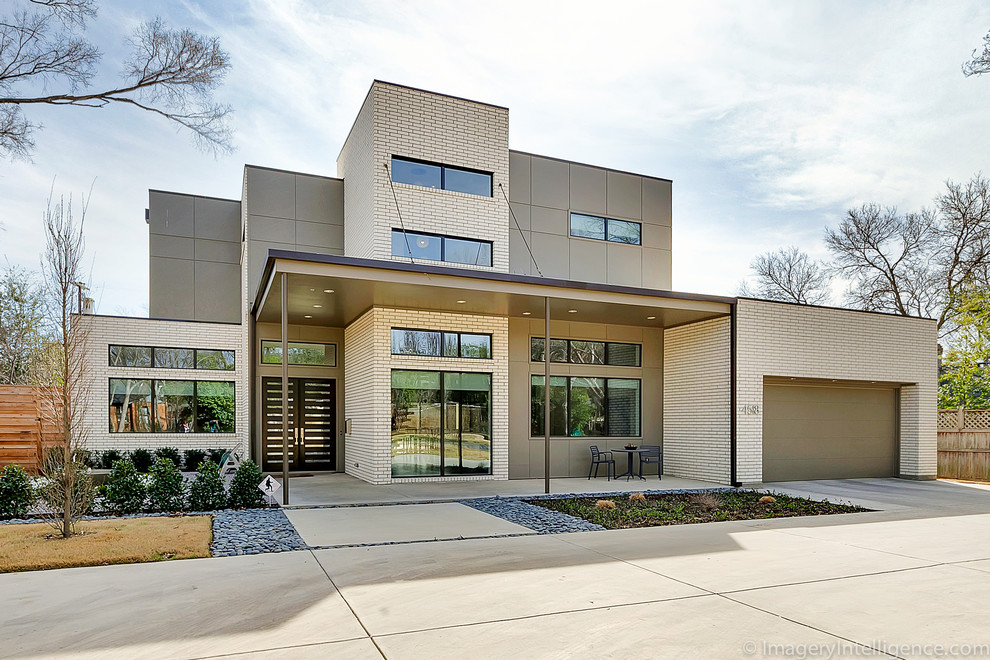 Design ideas for a beige contemporary house exterior in Dallas.