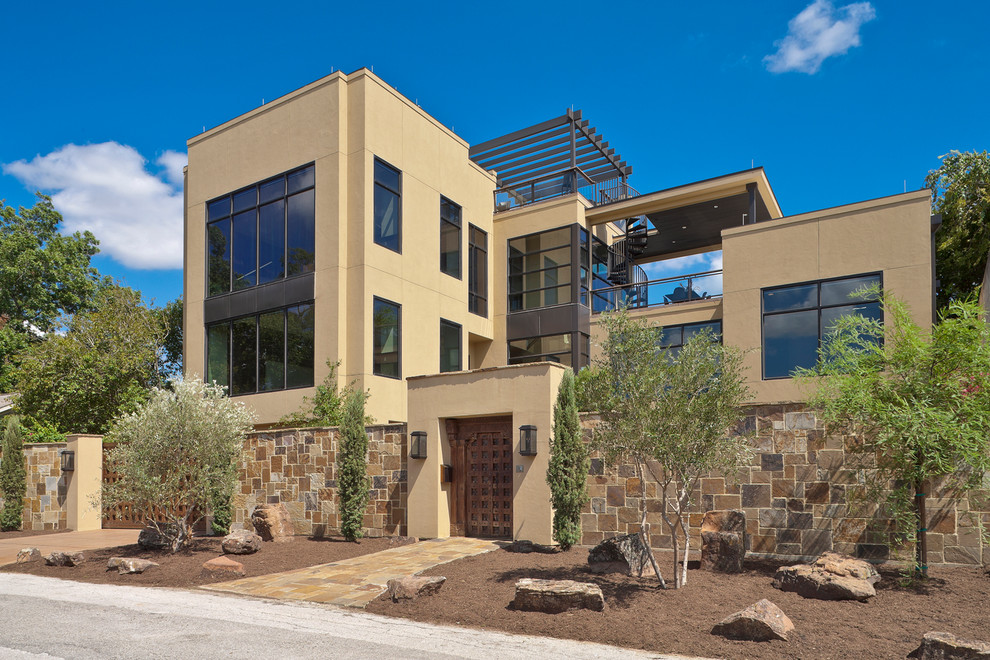 Contemporary three-story exterior home idea in Houston