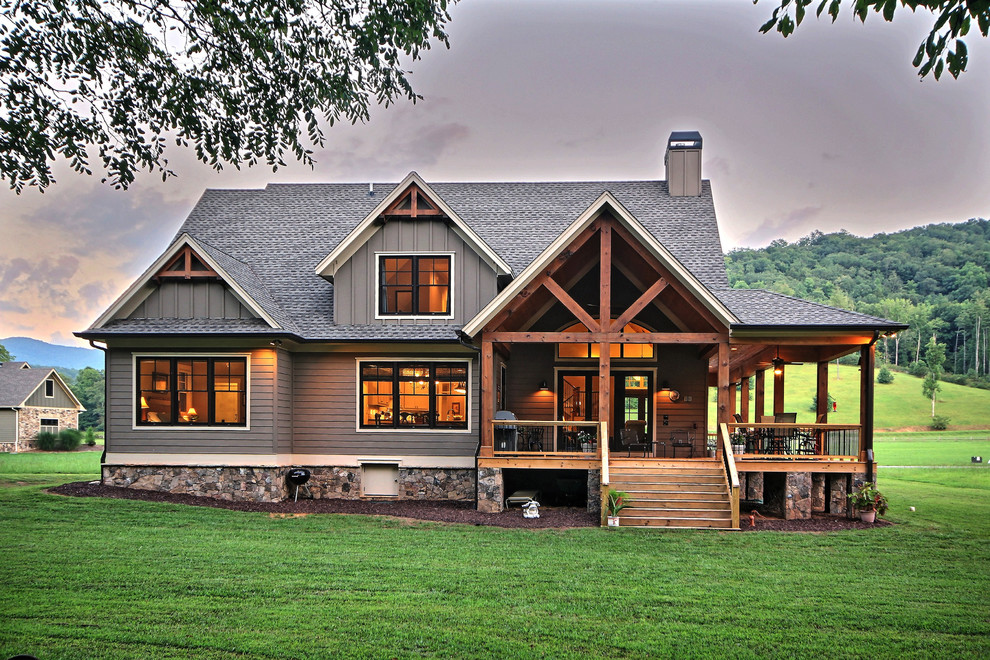 Photo of a medium sized and gey traditional two floor detached house in Atlanta with mixed cladding, a pitched roof, a shingle roof, board and batten cladding and shiplap cladding.