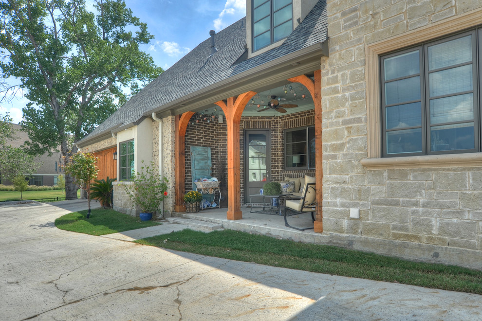 Example of a mid-sized classic two-story mixed siding exterior home design in Dallas