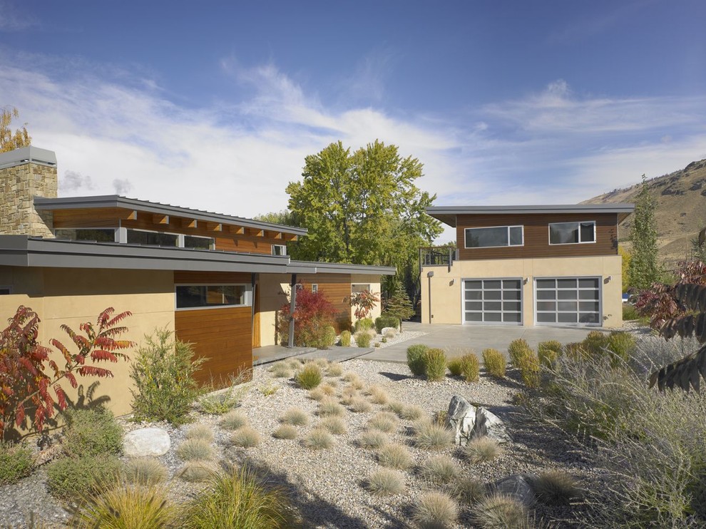 Inspiration for a contemporary house exterior in Seattle with wood cladding.