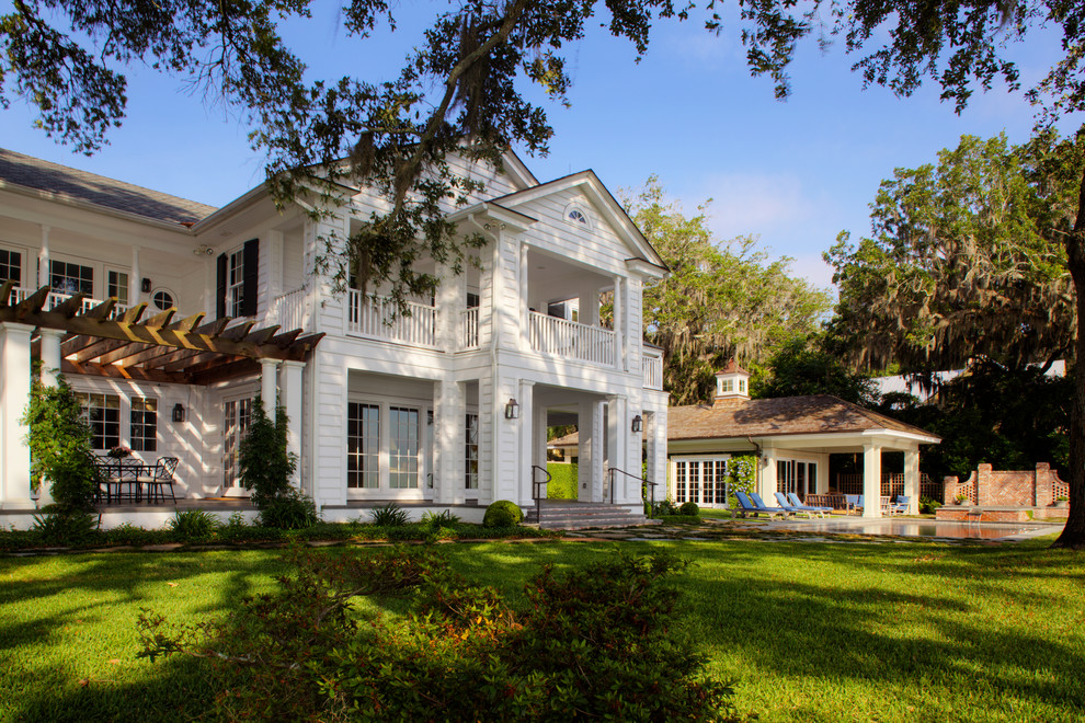Inspiration for a huge timeless white two-story wood gable roof remodel in Jacksonville
