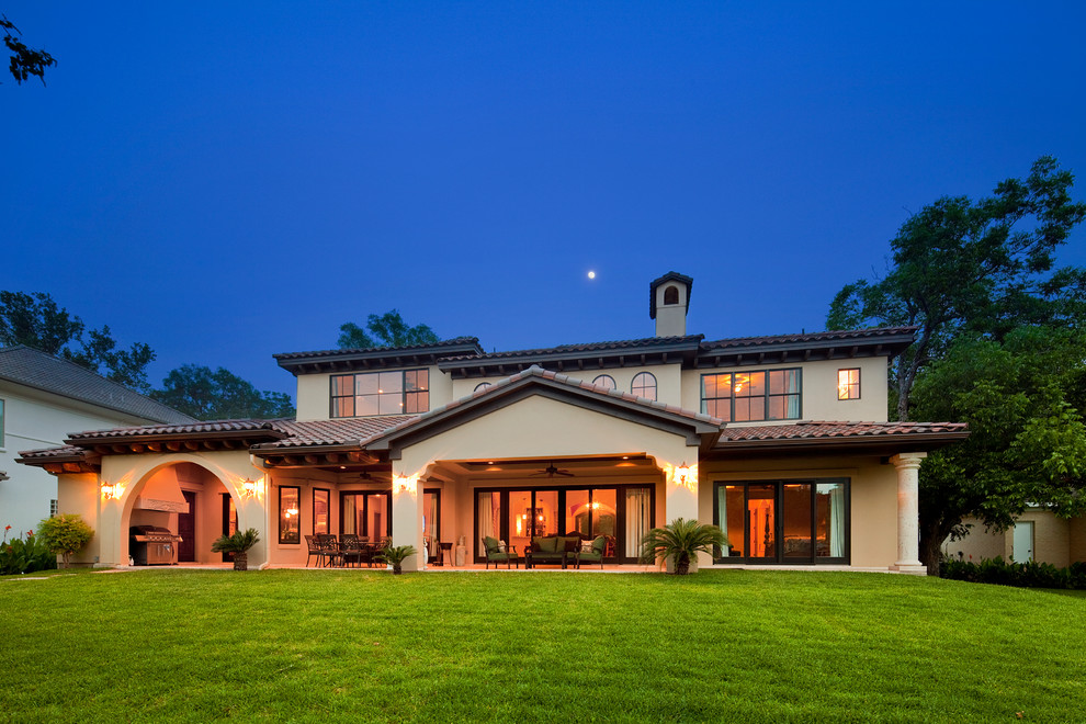 Photo of a mediterranean two floor house exterior in Austin.