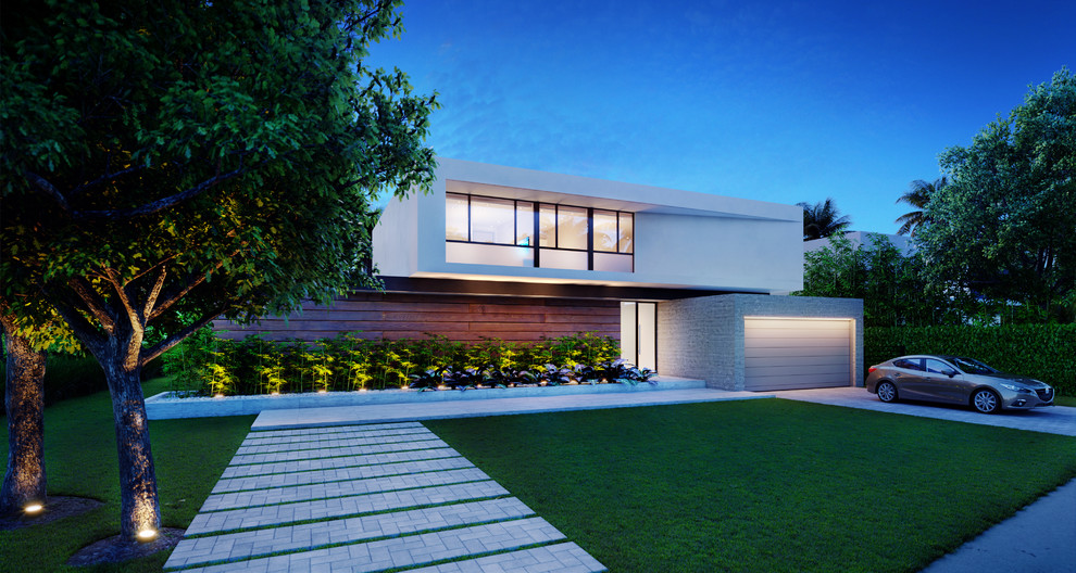 Large and gey contemporary two floor house exterior in Miami with mixed cladding and a flat roof.