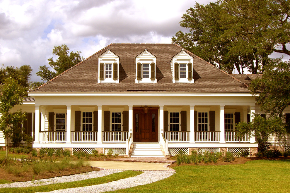 Design ideas for a classic house exterior in New Orleans with wood cladding.