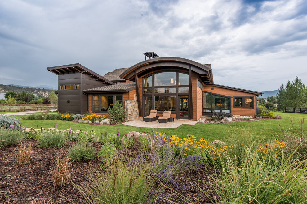 Example of an eclectic exterior home design in Denver