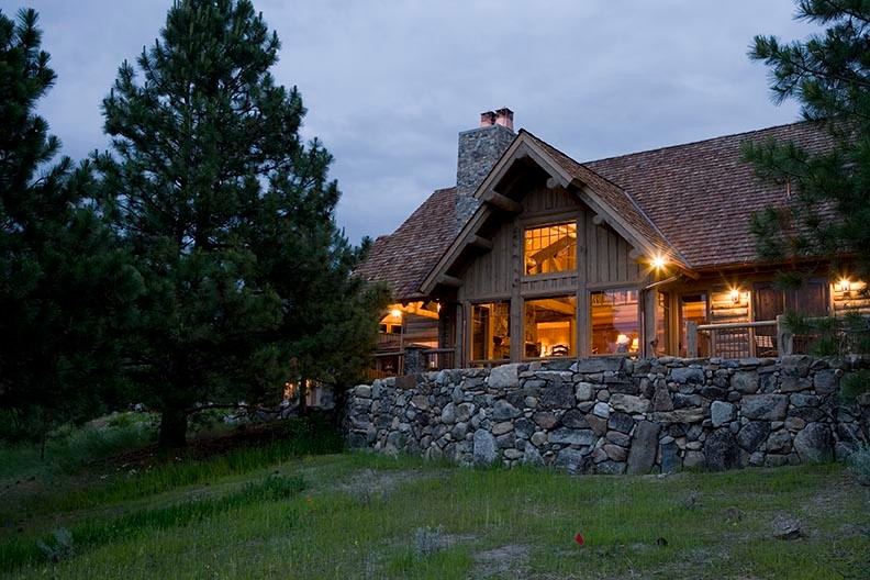 Example of a mid-sized mountain style gray two-story wood exterior home design in Other