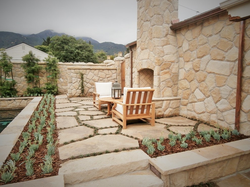 Inspiration for a mid-sized timeless beige one-story stone exterior home remodel in Santa Barbara