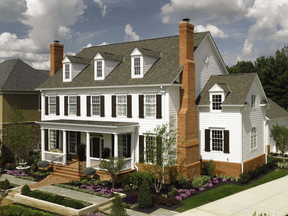 Inspiration for a mid-sized timeless white three-story vinyl exterior home remodel in Newark